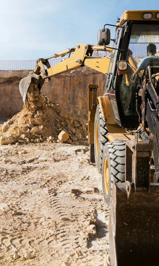 Excavator Moving Earth at Construction Site for Site Preparation